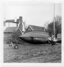 Hebron displays her hull shape. URYC dinghy park C1966
